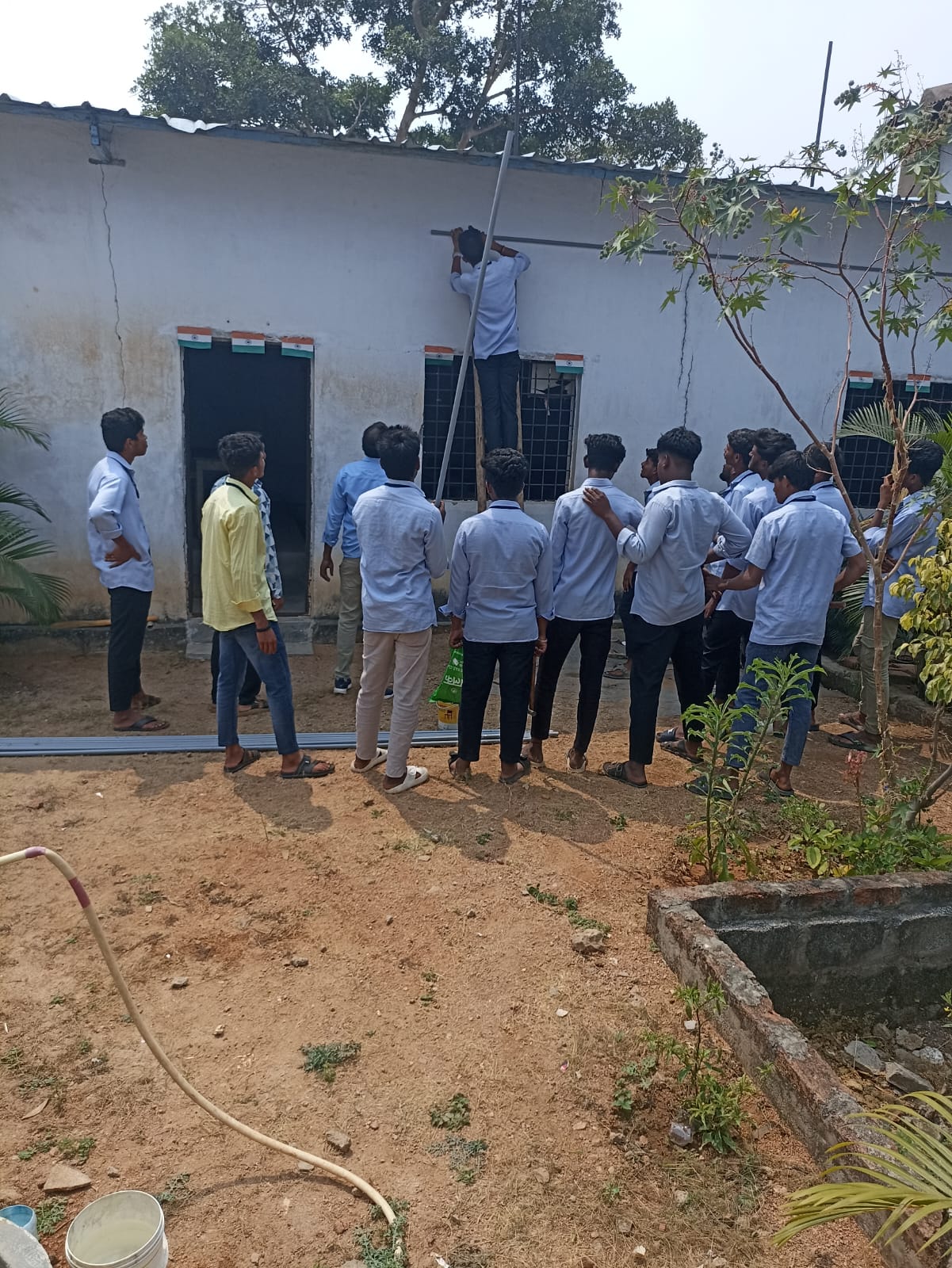 Students participating in campus maintenance activity